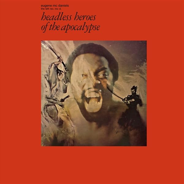 Album cover: distorted portrait with figures holding weapons, orange background.