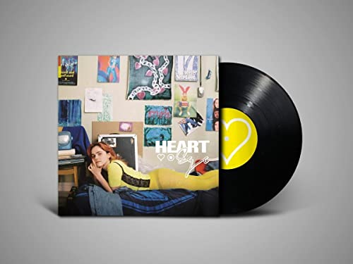 Vinyl record with album cover featuring a woman lounging in a room.