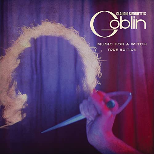 Vinyl album cover: a hand holding a blade, ghostly figure, purple backdrop.