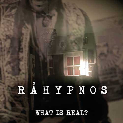 CD cover with a blurred image of a house and shadowed figure.