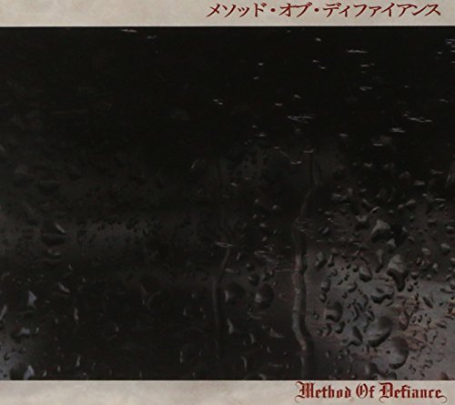 Dark album cover with rain-streaked window and ornate text below.