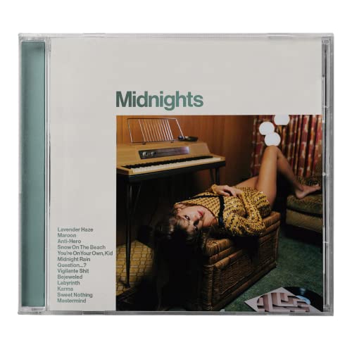 Taylor Swift’s “Midnights” CD in jade green case, featuring a piano and woman.