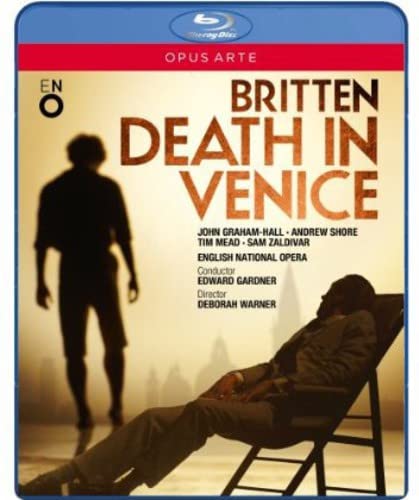 Blu-ray cover for Brittenās āDeath in Veniceā opera, figures on a beach.