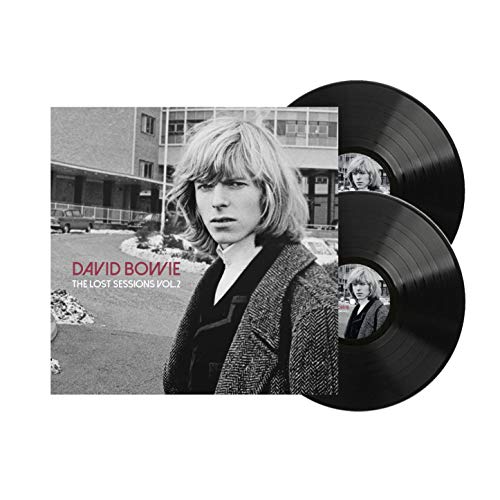 David Bowie album cover and two black vinyl records.