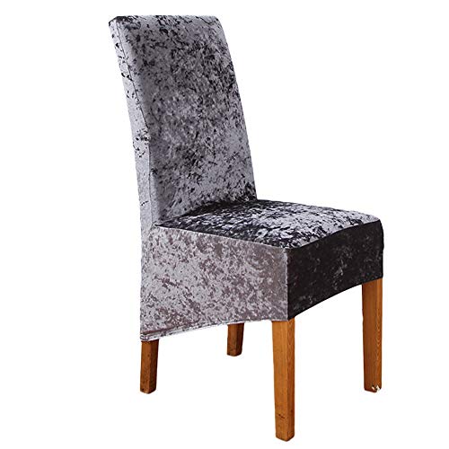 Gray velvet stretch chair cover on a wooden chair.