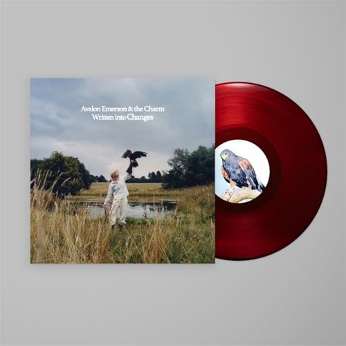 Red vinyl record with album cover featuring a person and birds.