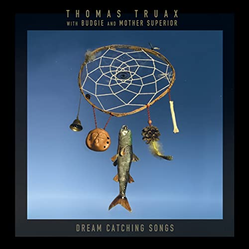 CD cover: dreamcatcher with fish, bone, and bell against blue sky.