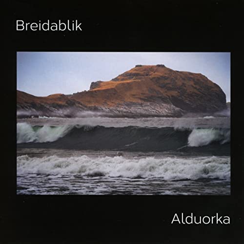 CD cover: coastal landscape with waves crashing against a rocky hill.