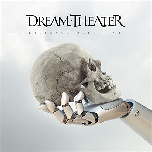 A robotic hand holds a human skull against a cloudy, light grey background.