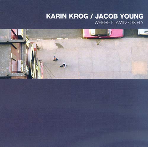 CD cover: dark blue background, aerial view of vehicles and figures.