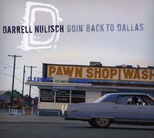 CD cover: vintage car in front of a pawn shop wash.