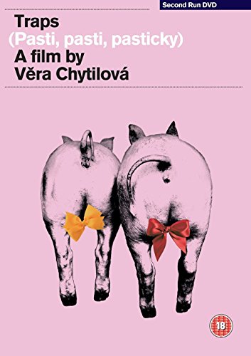 DVD cover for “Traps” featuring two pink pigs with red bows.