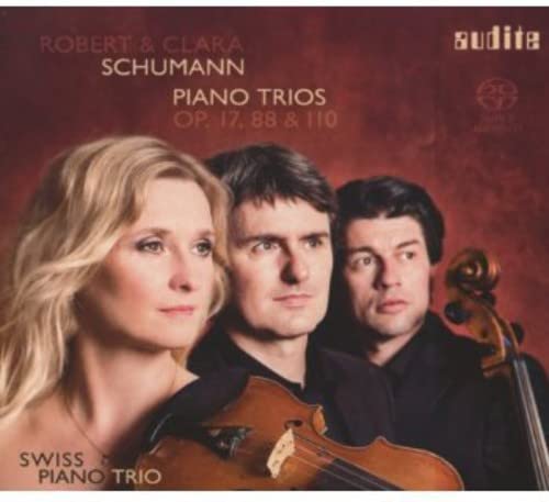 CD cover featuring three musicians and a violin, titled “Schumann: Piano Trios.”