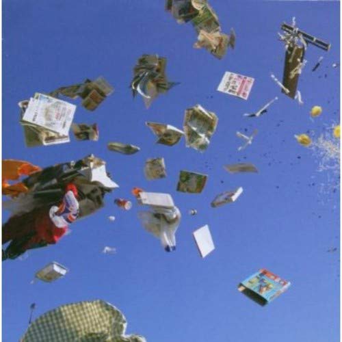 Blue sky filled with numerous colorful kites of various shapes and sizes.