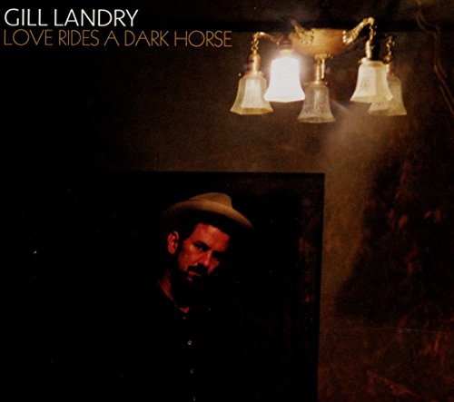 CD cover: portrait of a man with a hat under a chandelier.
