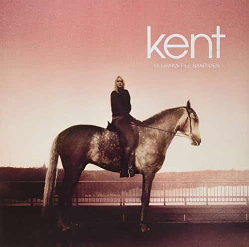 Album cover: person on horseback against a hazy, pink landscape.