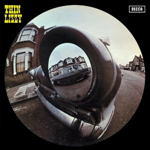 Thin Lizzy album cover: a tire and street scene in a fisheye view.