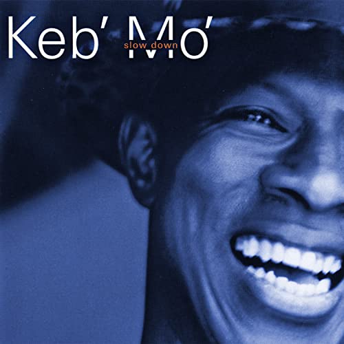 Close-up of Keb' Mo' smiling, album cover for "Slow Down" CD.