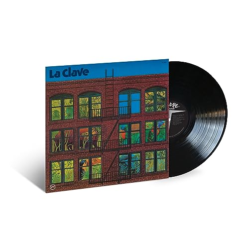 Vinyl record of "La Clave" with a building illustration on the cover.