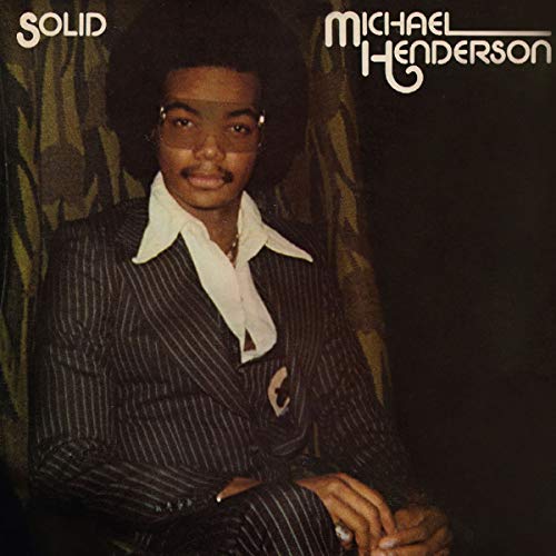 AlbumLp cover of Michael Henderson's Solid featuring a man in a pinstripe suit.