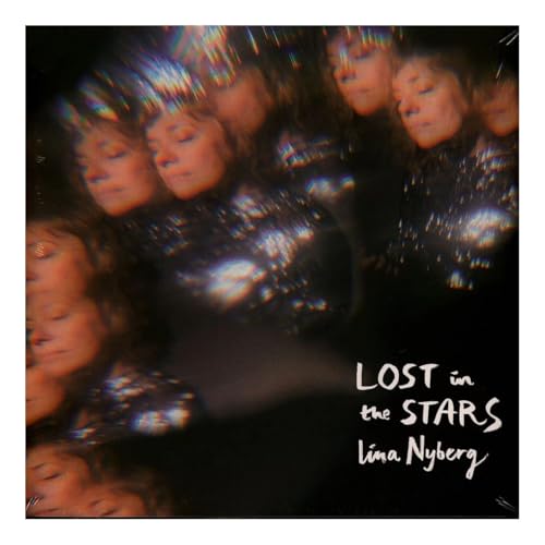 Vinyl album cover featuring blurred portraits and text "Lost in the Stars".
