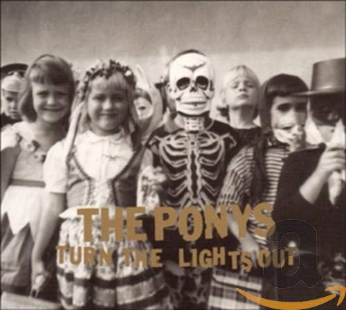 Black and white photo of children in Halloween costumes, album cover.