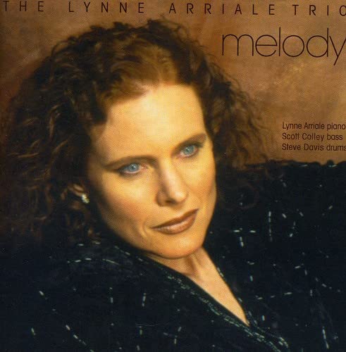 CD cover featuring Lynne Arriale, a pianist with red curly hair.