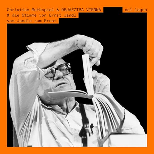 CD cover: black and white photo of a man reading a book.