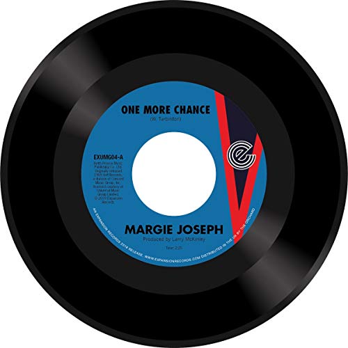 Black vinyl record with blue label displaying “One More Chance” text.