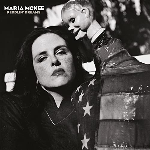 Maria McKee album cover: woman with a doll, black and white photo.