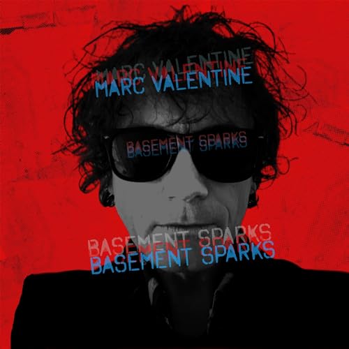 CD cover featuring a man with curly hair and sunglasses against a red background.