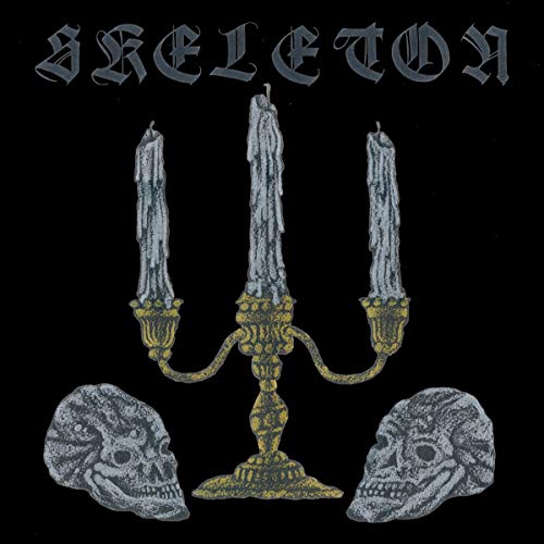 Black album cover with skulls, candles, and ornate gold candelabra.
