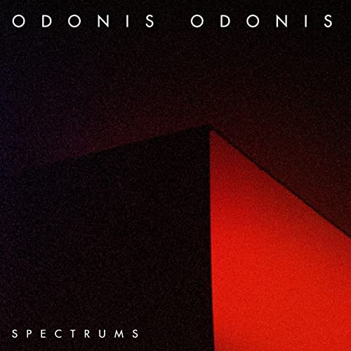 Album cover for Odonis Odonis’ “Spectrums” with red and black geometric shapes.