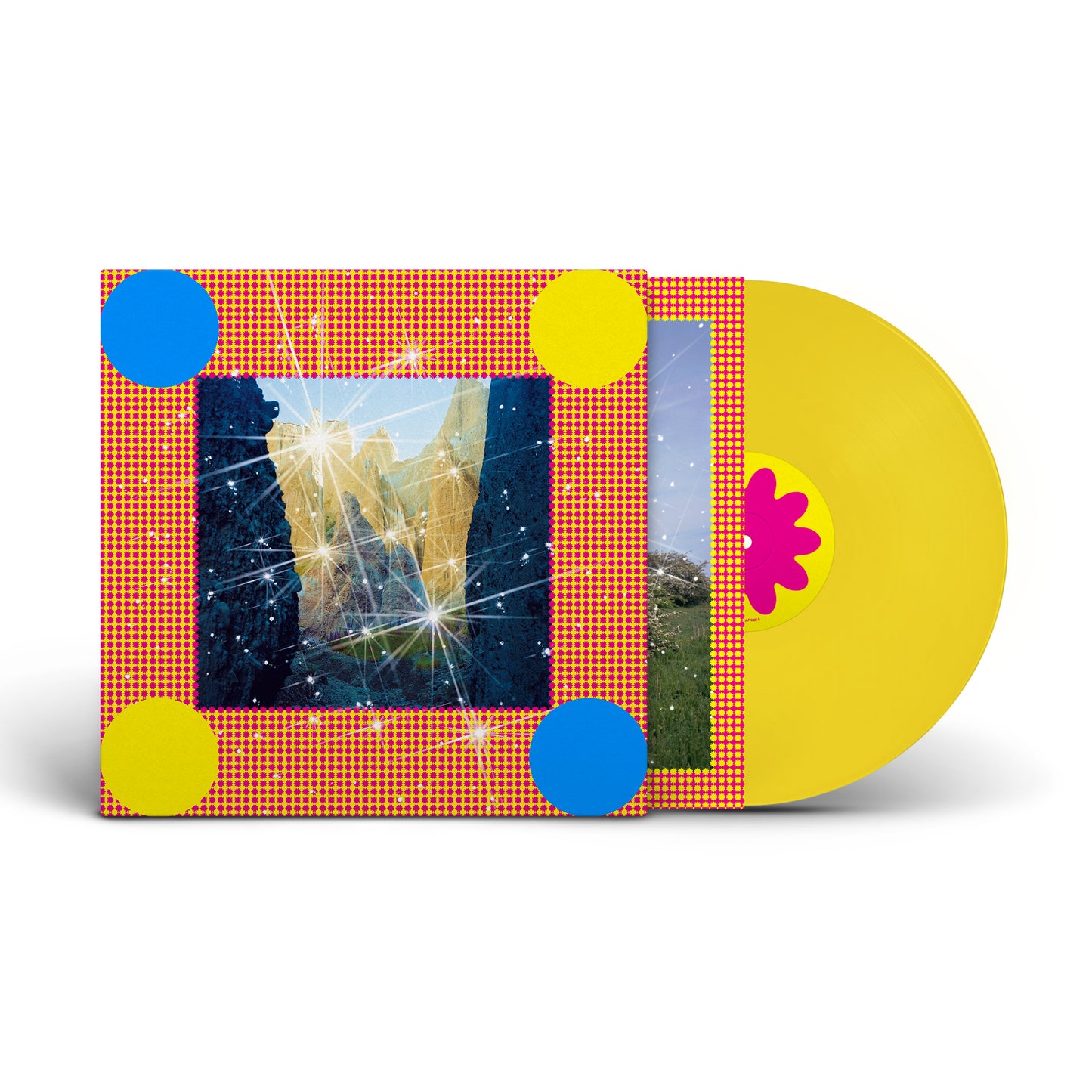 Yellow vinyl record with colorful, patterned album cover featuring a landscape.