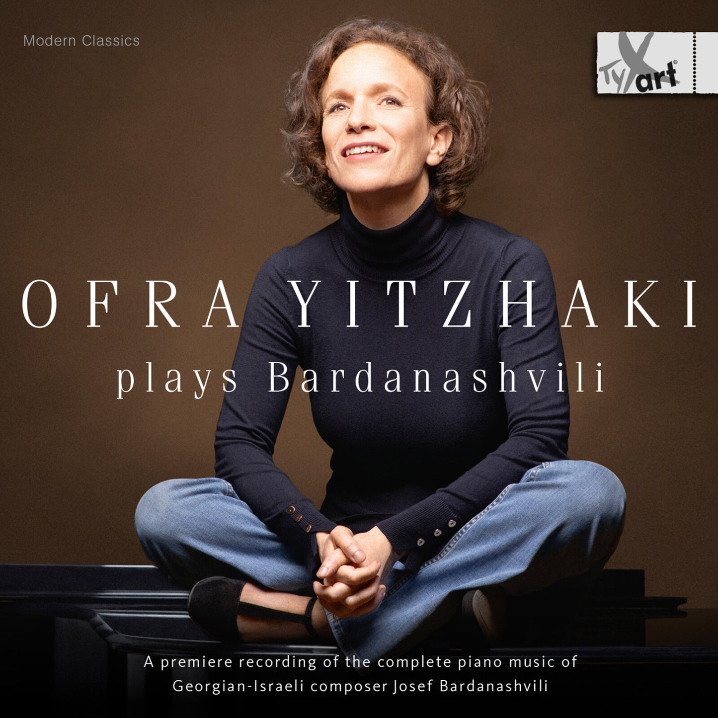 Ofra Yitzhaki album cover: pianist seated, dark background, silver text.