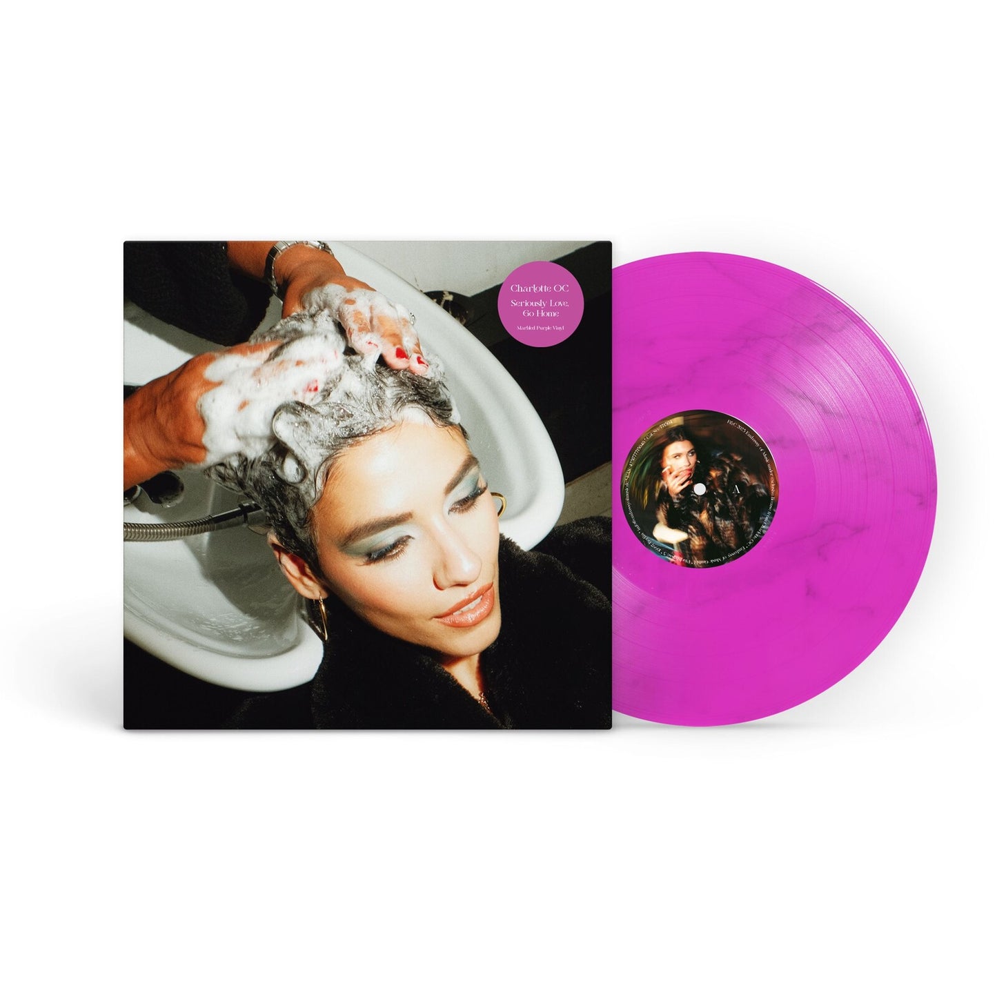 Vinyl record with album cover showing a woman getting her hair washed.