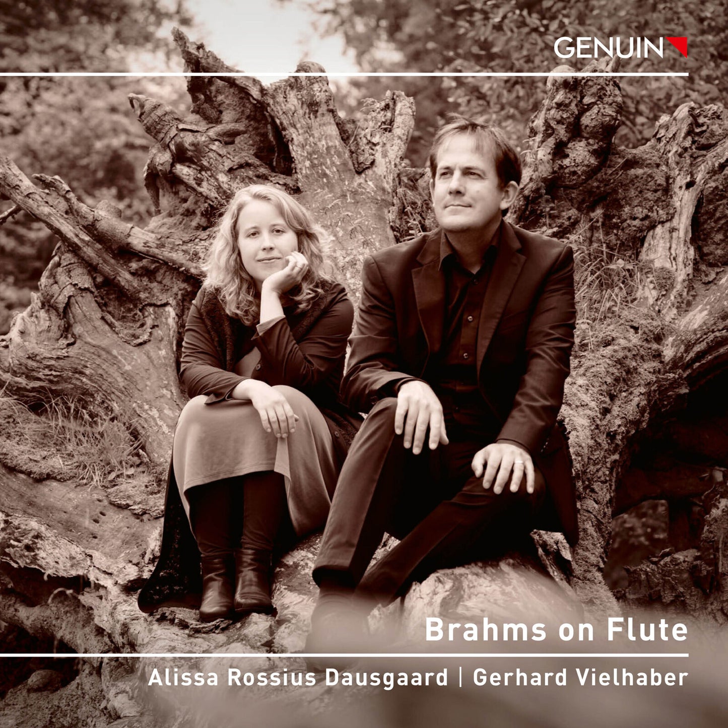 CD cover featuring two musicians seated amongst tree roots.
