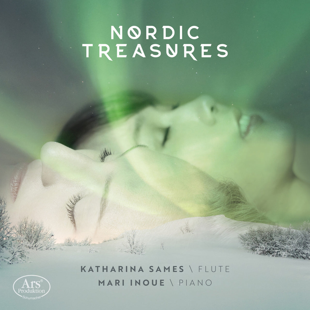 CD cover: woman’s face overlaid with a snowy, aurora-lit landscape.