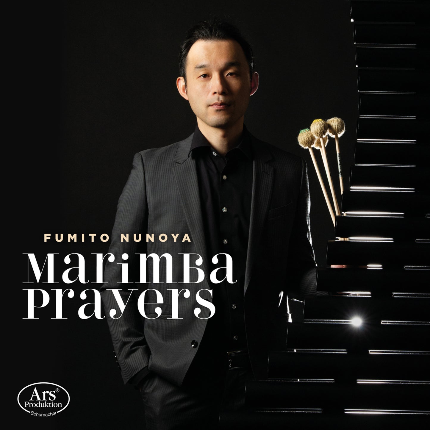 Fumito Nunoya in suit beside a marimba, album title "Marimba Prayers".