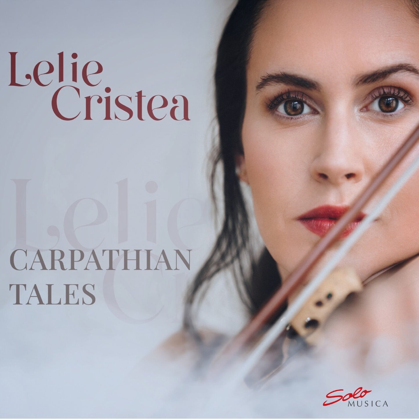 CD cover featuring a woman’s face and a violin, titled “Carpathian Tales”.