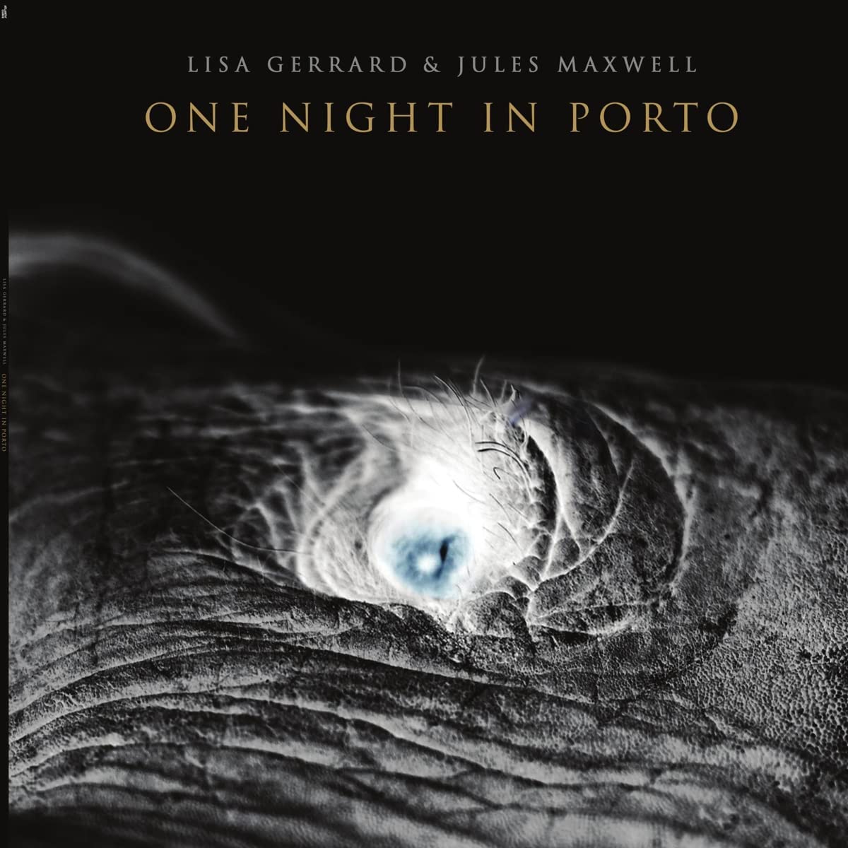 CD cover: close-up of an eye with dark, textured background.