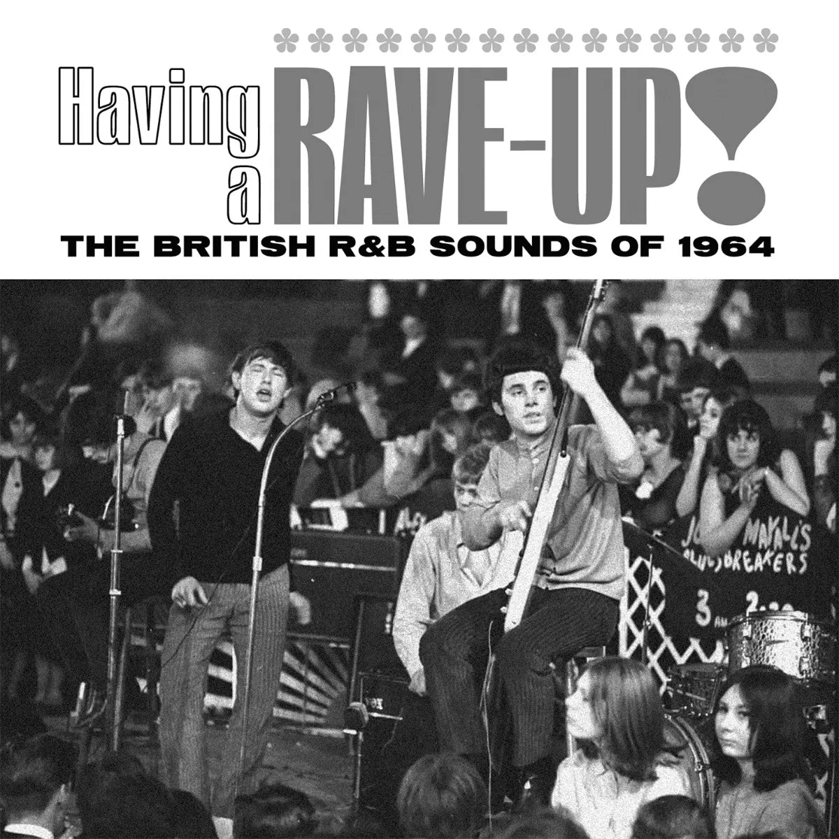 CD cover: black and white photo of a band performing live.