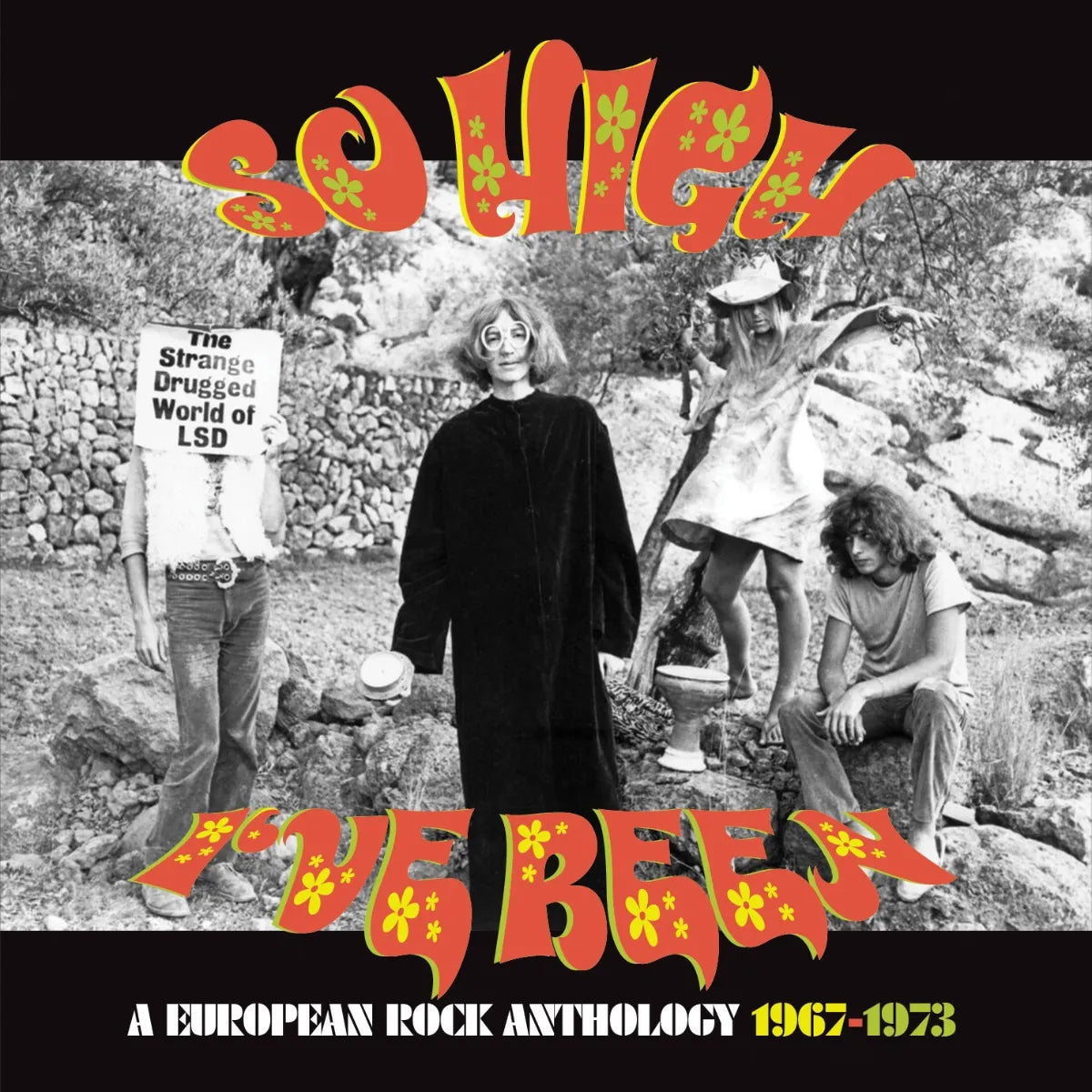 Black and white photo of four people outdoors with psychedelic orange text overlay.