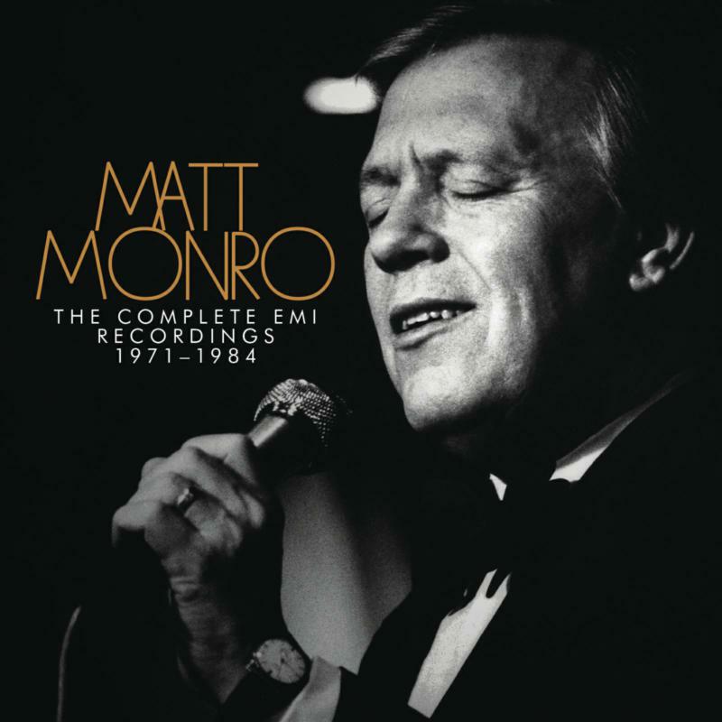 Black and white portrait of singer Matt Monro with a microphone.