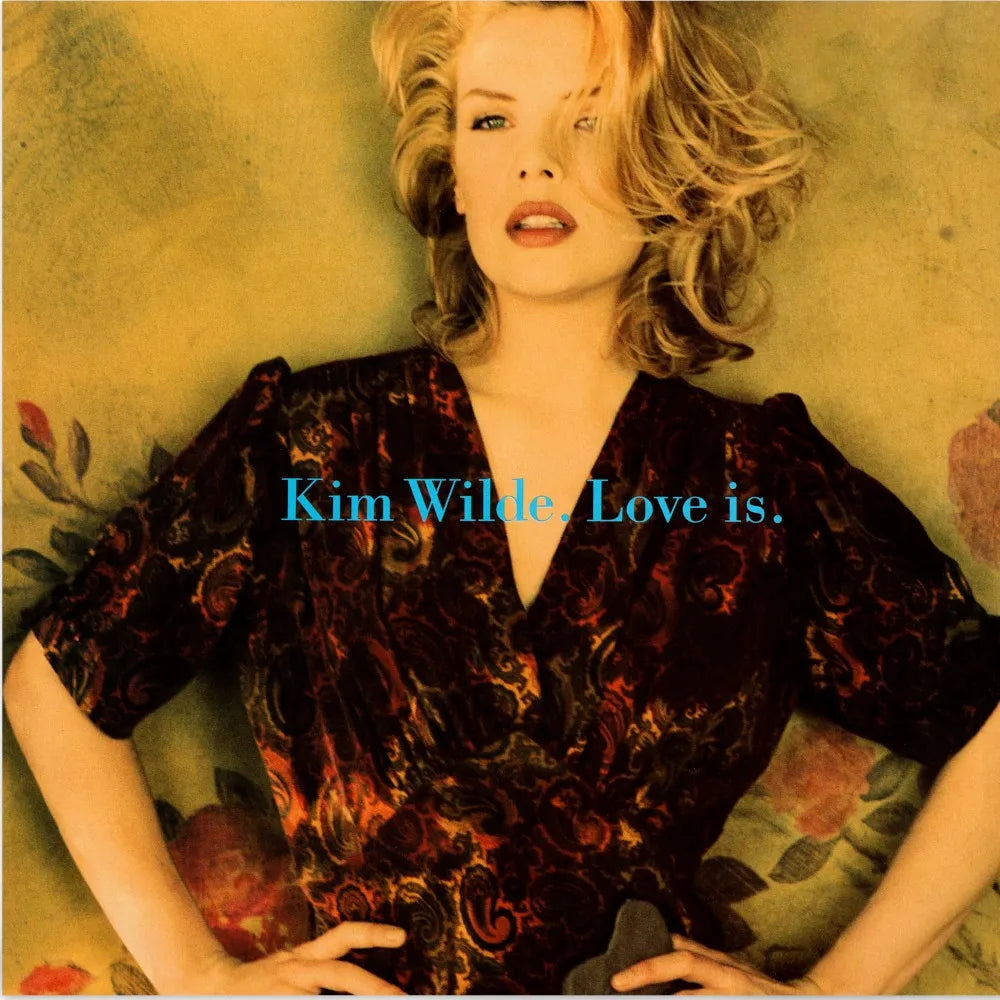 Kim Wilde album cover: blonde woman in a dark floral dress.