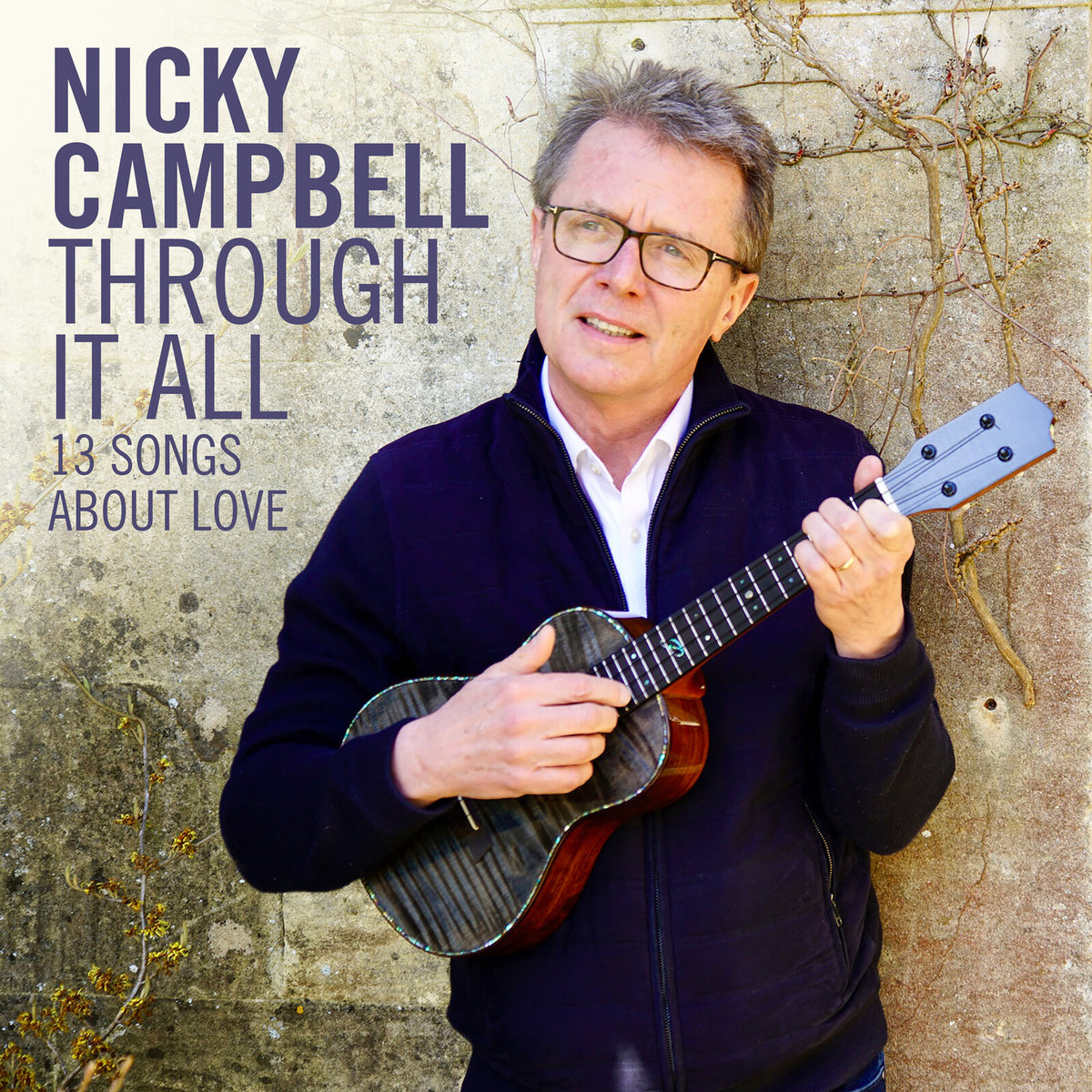Nicky Campbell holds a ukulele on the album cover "Through It All".