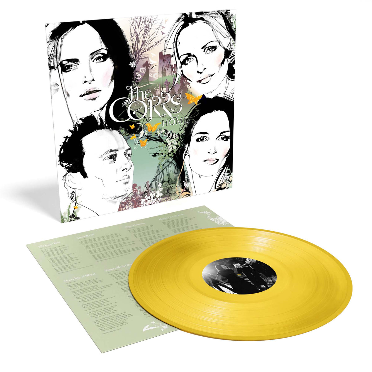 The Corrs “Home” vinyl record with yellow disc and album cover.