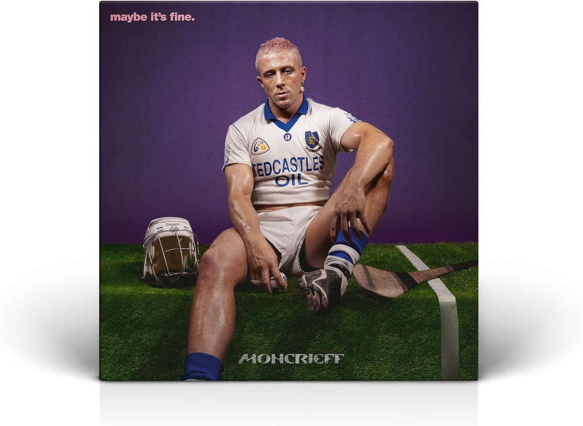 Album cover: Man in rugby shirt seated on artificial turf.