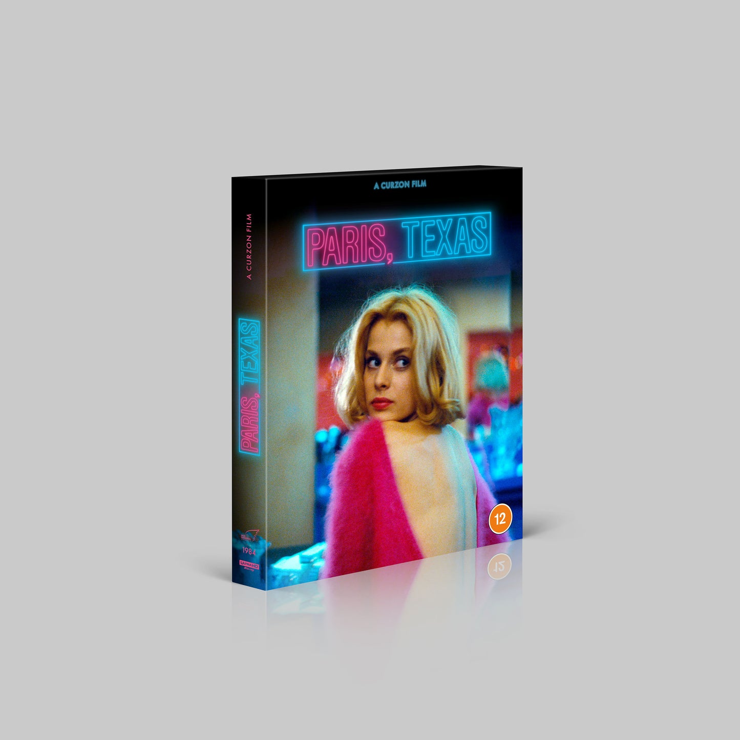 Paris, Texas 40th Anniversary Blu-ray case featuring a woman in a pink sweater.