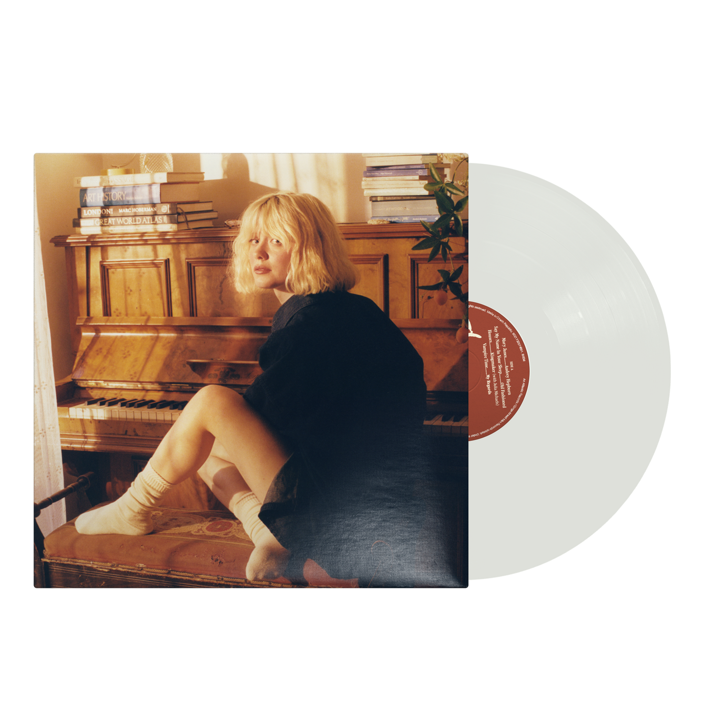 Maisie Peters album cover featuring a woman with blonde hair and a piano.